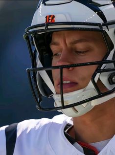 a close up of a football player wearing a helmet