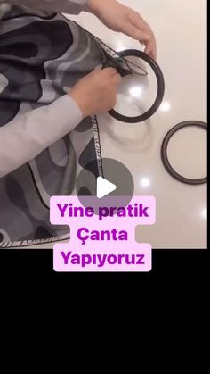 a person is holding some scissors on top of a table with the words vine pratik canta vapyrorouz