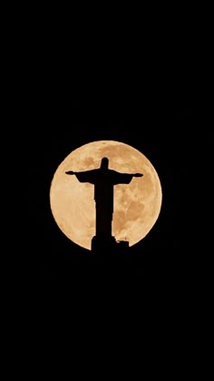 the statue of christ is silhouetted against the full moon in rio de la americas, brazil