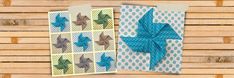 two folded greeting cards with origami birds on them, one is blue and the other is green