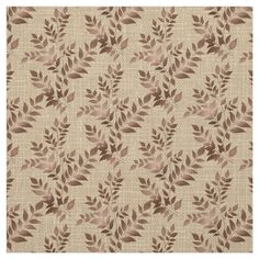 a beige and brown rug with leaves on it