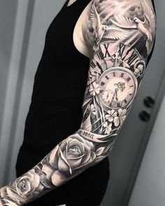 a man with a clock and roses tattoo on his arm