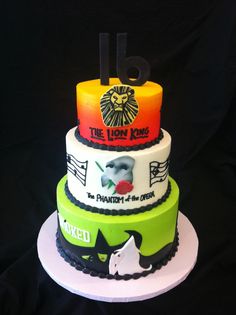 three tiered cake decorated with various logos on it's sides, including the lion king and queen