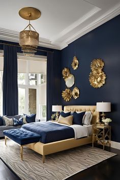 a bedroom with blue walls and gold accents