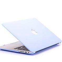 an open laptop computer sitting on top of a white table