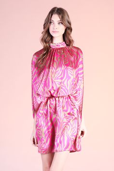 Add a little spice to your formal wear with our Frida Luxe Satin Mock Neck Caftan Mini Dress. This print is beautiful and gives the perfect touch of color to the closet. The dress pulls over the body and secures with a tie behind the neck. The waist is elastic to keep the body in place from day to night. Pair with minimal accessories and neutral shoes. SKU #: D-7931 Summer Evening Dresses With Tie Neck, Chic Floral Print Tie Neck Dress, Elegant Printed Pink Dresses, Chic Printed Cocktail Dresses, Chic Party Maxi Dress With Elastic Neckline, Pink Fitted Dress With Elastic Neckline, Chic Maxi Dress With Elastic Neckline For Party, Fitted Pink Dress With Elastic Neckline, Chic Printed Tunic Dress