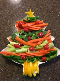 a christmas tree made out of vegetables on a plate