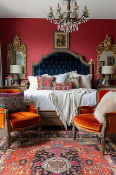 an ornate bedroom with red walls and gold trimmings, orange upholstered bed