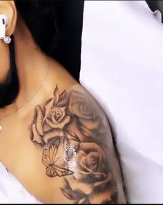 a woman with tattoos on her arm and shoulder