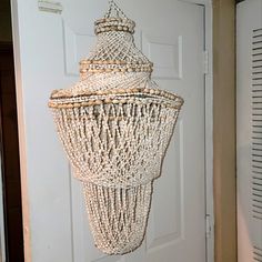 a chandelier hanging from the side of a door