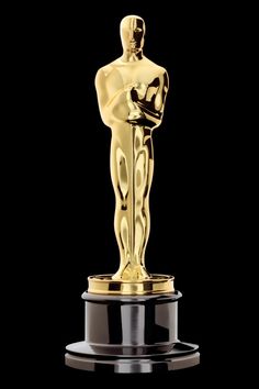 an oscar statue with the award for best actress in a motion