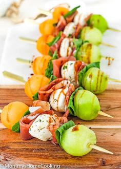 several skewers filled with meat and vegetables