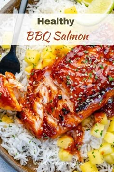 healthy bbq salmon with pineapple salsa and white rice in a bowl on a table