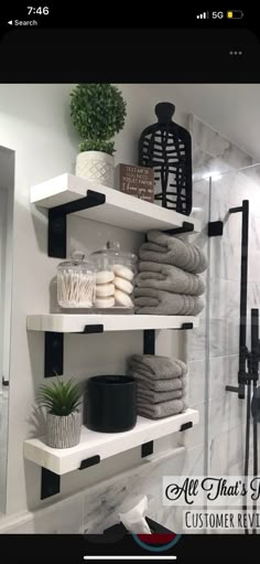 the shelves in this bathroom are filled with towels, soaps and other things to use