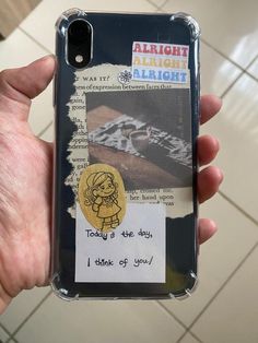 someone is holding up their phone case to show the message