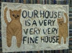 a rug with two cats on it that says our house is very very fine house