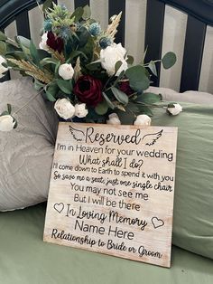 a wooden sign that says reserved i'm heaven for your wedding with flowers in it