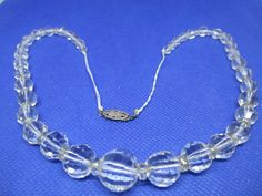 Never Worn. Vintage 1940s  single-strand graduating faceted clear crystal beads with oval faceted crystal beads necklace with 2 strands of white fabric threat at each end of the necklace sterling silver-push in clasp. The clasp is not marked. Length 19 & 3/8 inches.  I offer discounted combined shipping charges. Crystal Beads Necklace, Metal Pendant Necklace, Crystal Bead Necklace, Gemstone Beaded Necklace, Clasp Necklace, Onyx Necklace, Beaded Pendant Necklace, Gold Tone Necklace, Amethyst Necklace