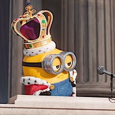 a cartoon character wearing a crown and holding a magnifying glass in front of a microphone