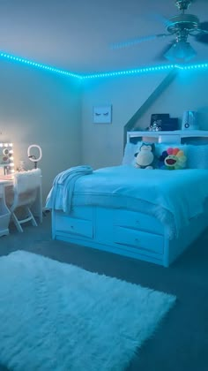 a bed room with a neatly made bed and lights