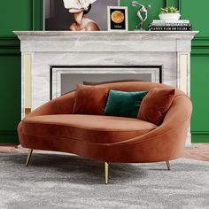 a living room with green walls and a brown couch in front of a fireplace that has pillows on it