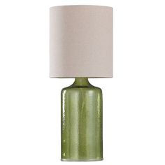 a green glass table lamp with a white shade on the top and bottom part of it