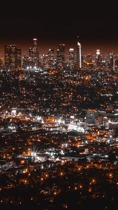 an aerial view of the city lights at night