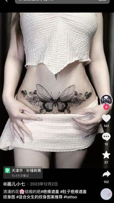 a woman with a butterfly tattoo on her stomach