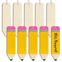 four yellow and pink pencils with name tags attached to the back of each one