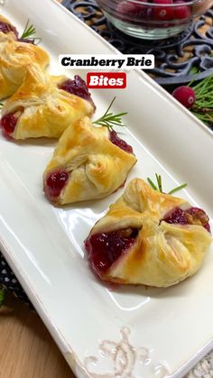 cranberry brie bites on a white plate