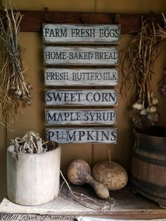 there is a sign that says farm fresh eggs, home - baked bread, sweet corn, maple syrup, and pumpkins