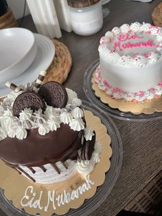 two cakes decorated with oreo cookies and white frosting