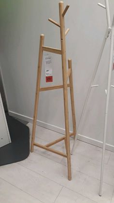 a wooden ladder leaning against the wall