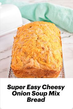 A loaf of onion soup mix bread on wire rack. Casserole Bread Recipes, Best Soup Bread, French Onion Cheese Bread, French Onion Soup Bread, Onion Soup Bread Recipe, Savory Quick Bread Recipes Simple, Onion Soup Bread 1968, Canned Bread Recipes, Onion Bread Machine Recipe