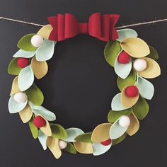 a paper wreath is hanging on a rope