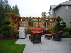 an outdoor living area with patio furniture and grill