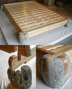 the bed frame is made out of wood and has two large rocks on each side