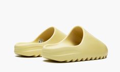 The adidas Yeezy Slide “Desert Sand” is one of the debut 2019 editions of Kanye West’s slip-on sandal designed for lounging and post-activity wear.  An early colorway of the Yeezy Slide, the “Desert Sand” continues West’s penchant for earth tones as the model’s entire one-piece EVA foam body is painted in a versatile beige hue.  The midfoot arch stabilizes the foot and provides all-day comfort.  A ridged outsole ensures ample traction on various surfaces. 70s Converse, Adidas Yeezy Slide, Sand Shoes, Nike X Travis Scott, Ugg Ultra Mini, Converse Run Star Hike, Adidas Models, Yeezy Slides, Converse Run Star