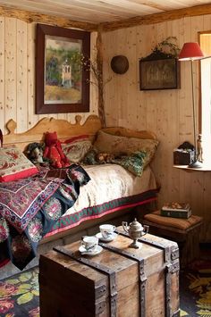 a bed sitting in a bedroom next to a window