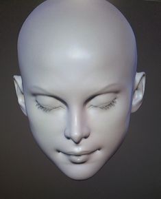 a white mannequin head with eyes closed