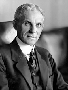 an old black and white photo of a man in a suit with his eyes wide open