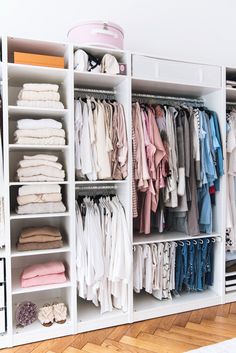 an organized closet filled with clothes and other items