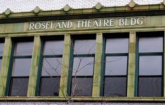 the roseland theatre bldg building has green windows