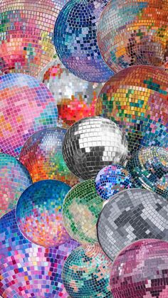 many disco balls are stacked up together