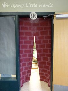 an open door with a red brick wall and the words helping little hands on it