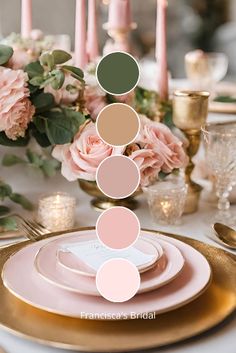 the table is set with pink and gold plates, silverware, candles and flowers