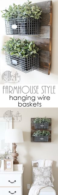 two baskets with plants are hanging on the wall next to a bed in a bedroom