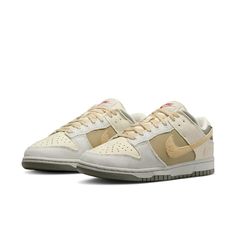 The Nike Dunk Low combines retro flair with modern comfort. Crafted from a mix of leather and textile, these kicks pay homage to '80s basketball aesthetics. The padded, low-cut collar ensures all-day comfort, whether you’re hitting the court or strolling the streets. The colorway features a sophisticated blend of Coconut Milk, Sesame, Alabaster, Light Bone, Neutral Olive, and Dark Stucco. With its extra Swoosh on the heel, this Dunk Low is a stylish nod to the past, perfect for sneaker enthusiasts and fashion-forward individuals alike. Dunk Low Light Bone, Alabaster Light, Dark Stucco, 80s Basketball, Basketball Icon, Yeezy Boots, Clog Boots, Nike Models, Dunks Nike