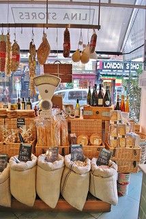 a display in a store filled with lots of different types of breads and wine