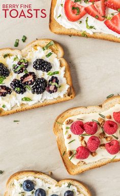 two pieces of bread with peanut butter, bananas and strawberries on them next to a bowl of fruit